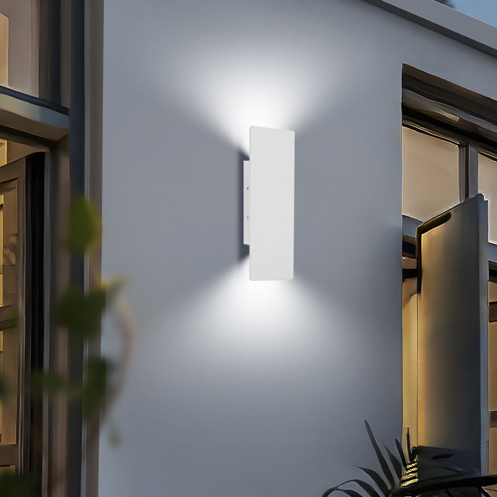 Bright white waterproof LED wall lamp illuminating a modern patio entrance