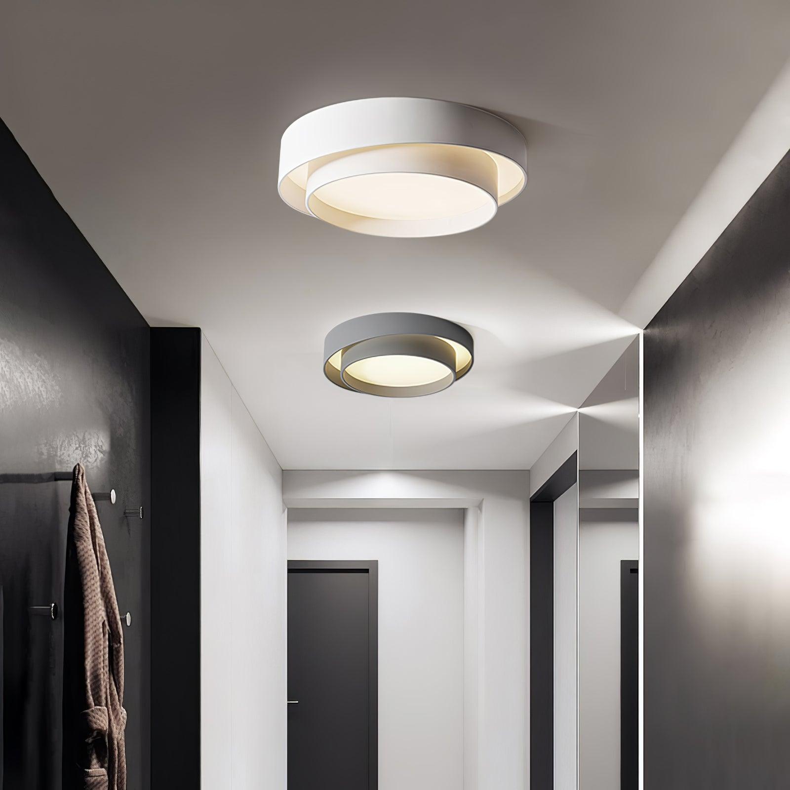 minimalist wlip white and grey layered halo ceiling lights installed in a modern, bright hallway corridor.