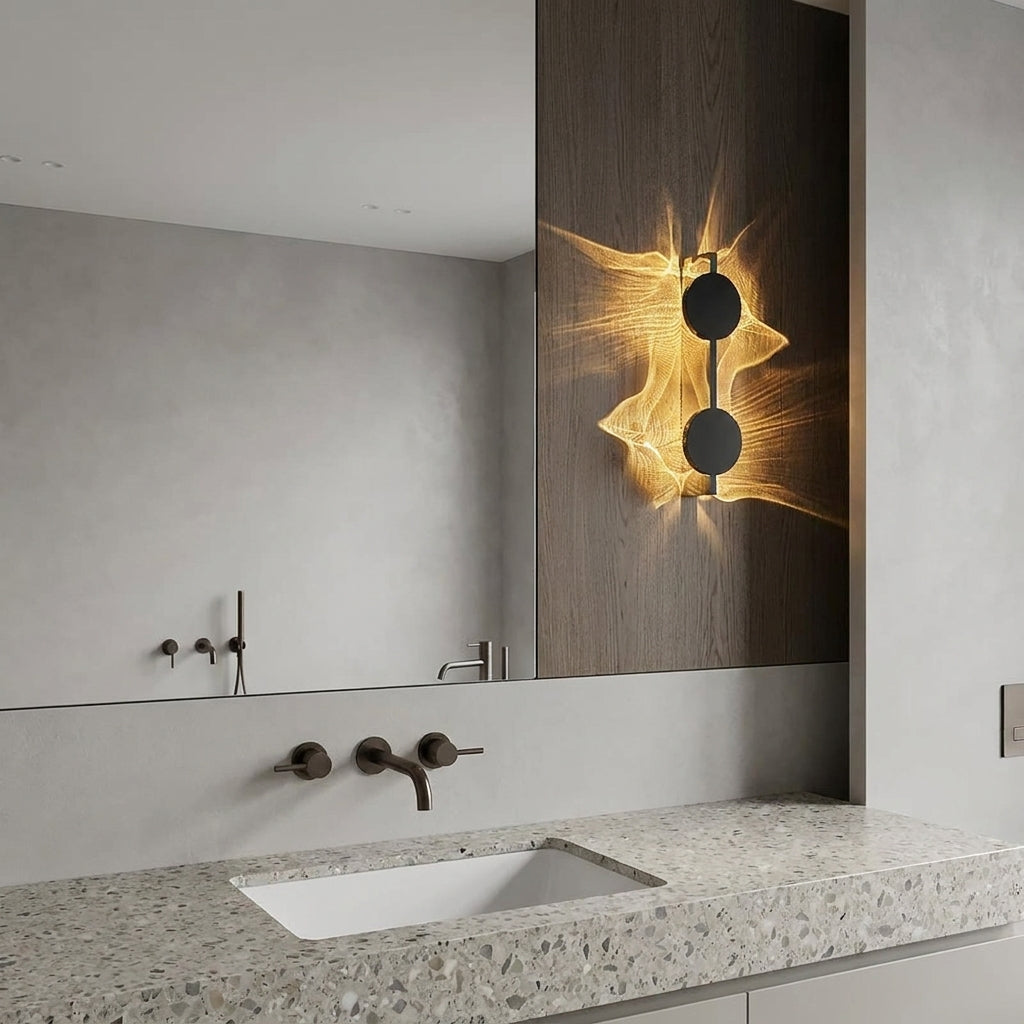 Wobzi Duo wall sconce mounted above a bathroom sink and mirror