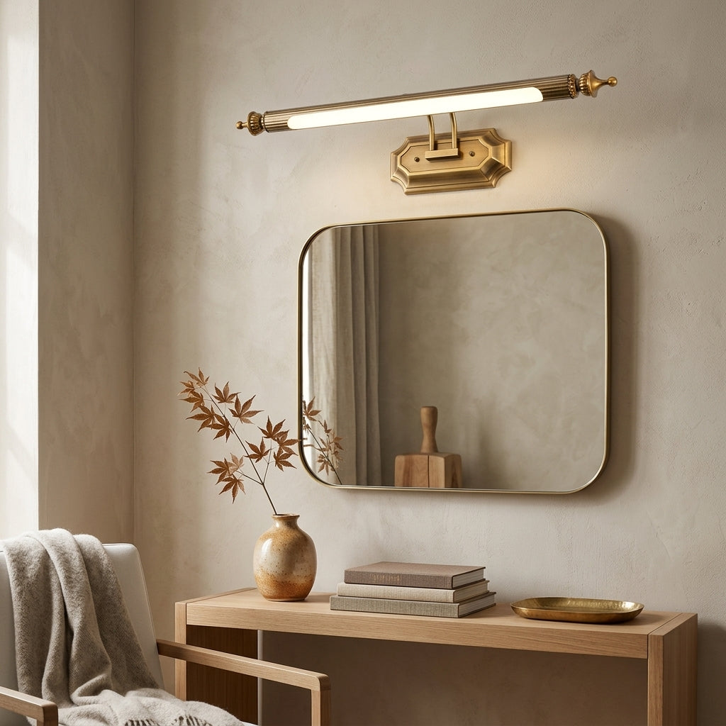 Wuxqa bronze wall light mounted beside a round mirror above a dresser table