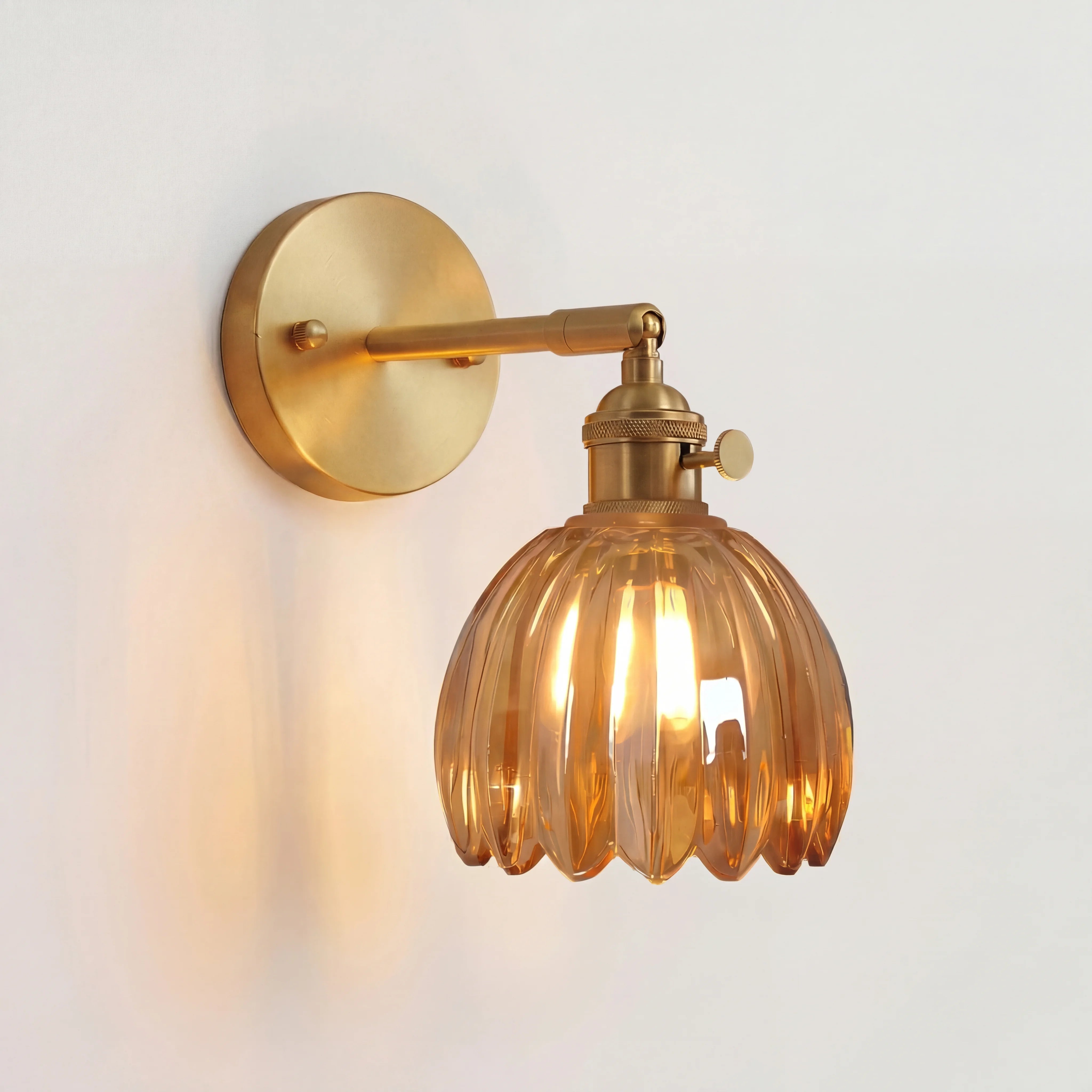 Illuminated amber retro floral glass xetyl wall lamp isolated against a light wall
