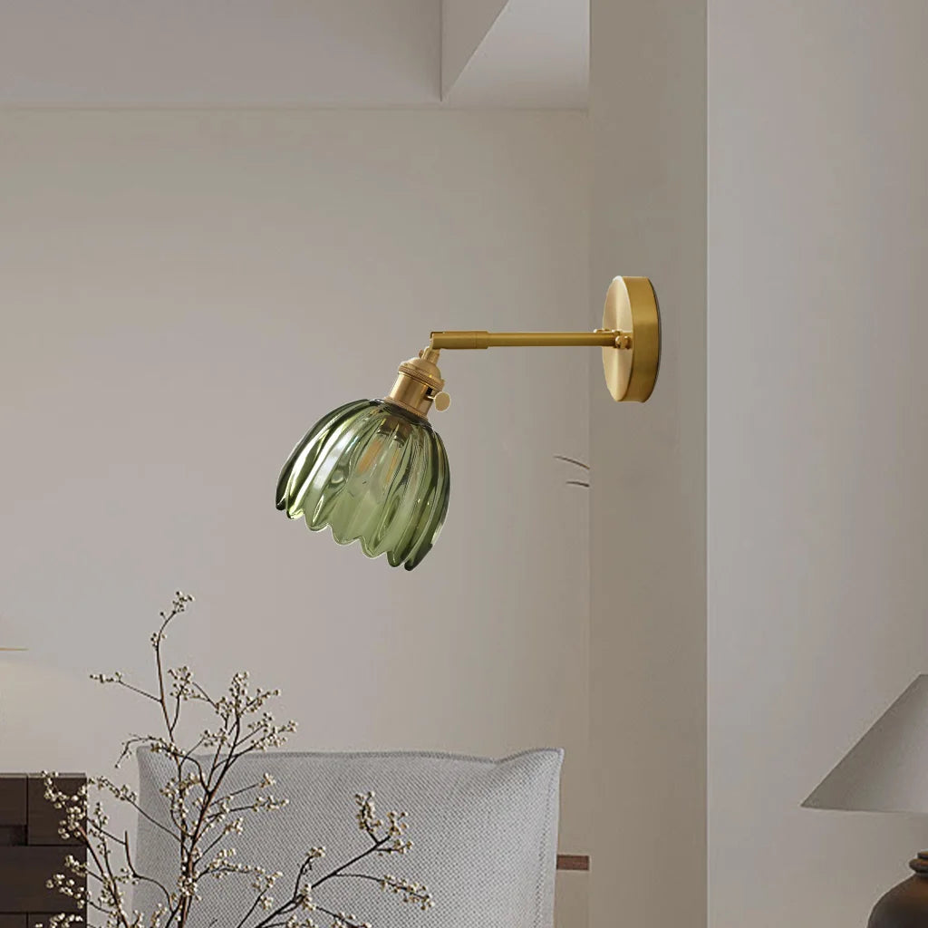 Green xetyl floral glass wall lamp adding a pop of colour to a bright, airy living space