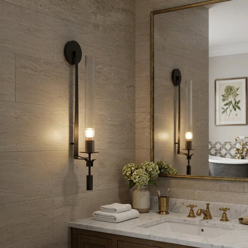 Xilpo Matte Black wall sconce on a beige wall tiles inside a bathroom next to a mirror and sink