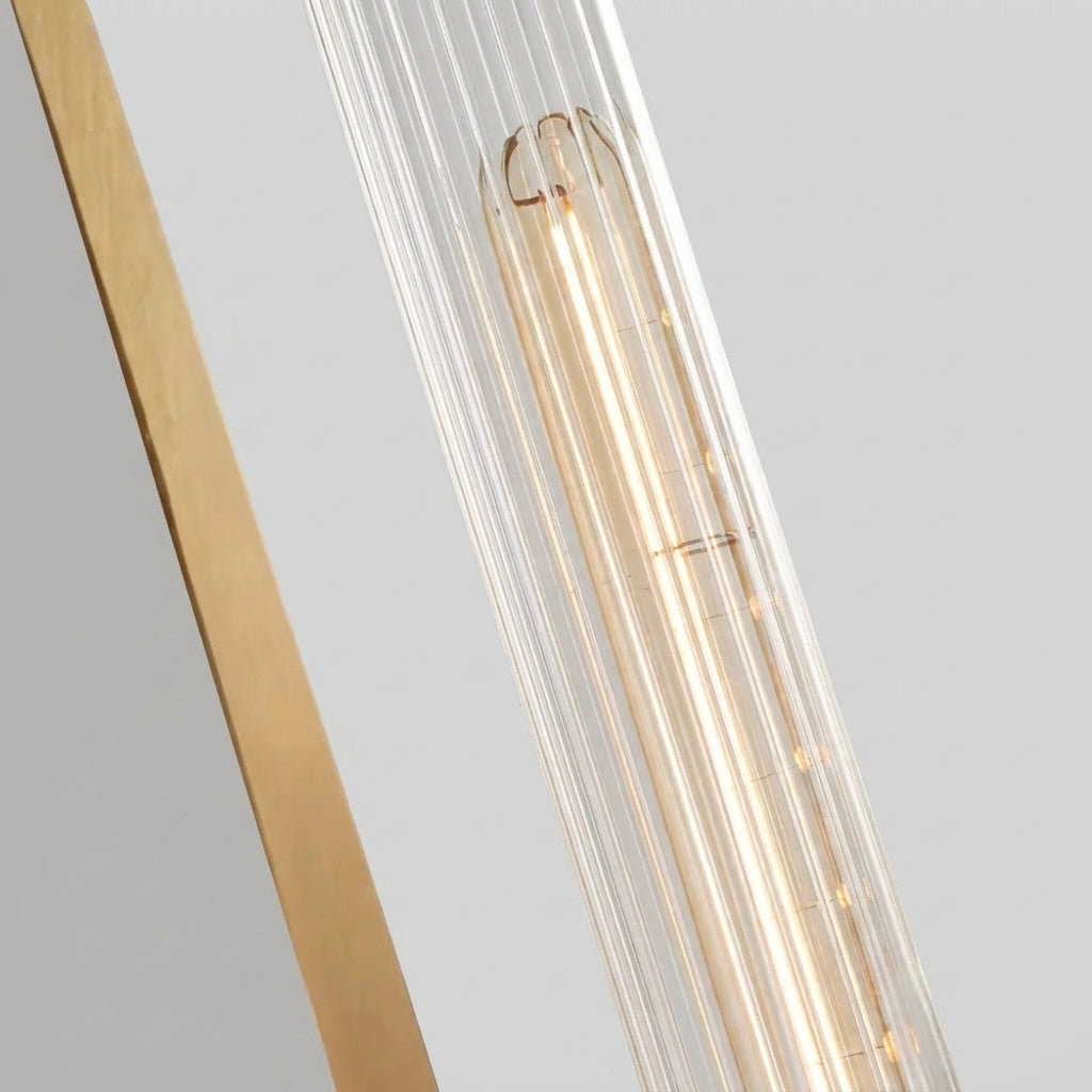 Close-up angled shot of the Xilpo Satin Gold wall sconce's fluted glass shade