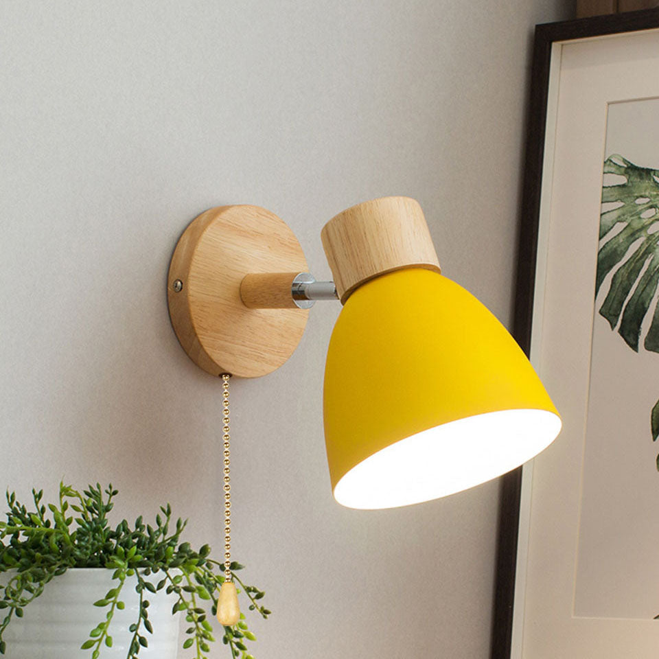 Yellow adjustable bedside reading light with a pull cord, highlighting its premium wooden base