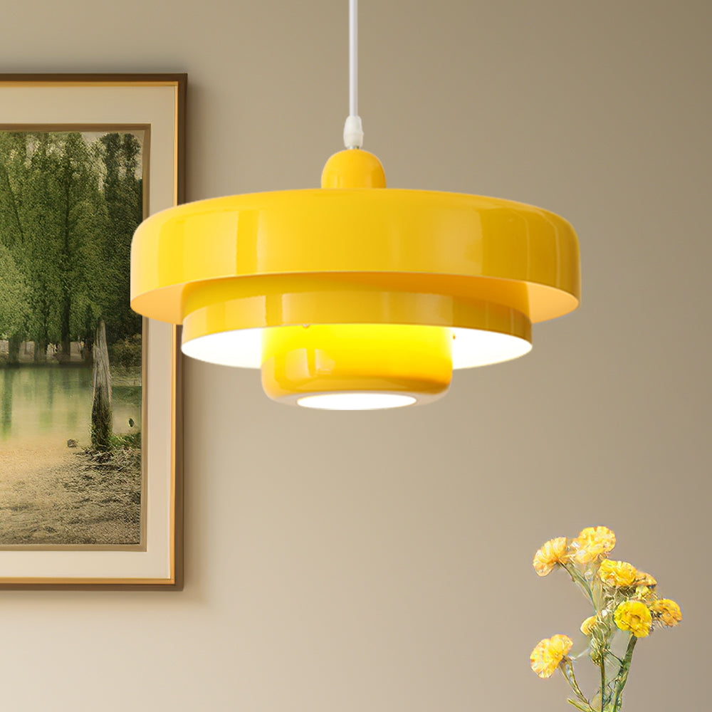 Cheerful yellow Bauhaus layered pendant light illuminating a classic interior with artwork