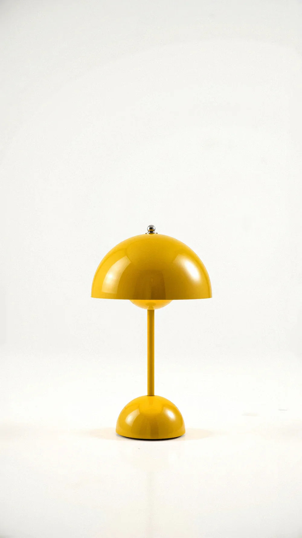 Bright yellow retro dome table lamp highlighting its smooth, glossy finish