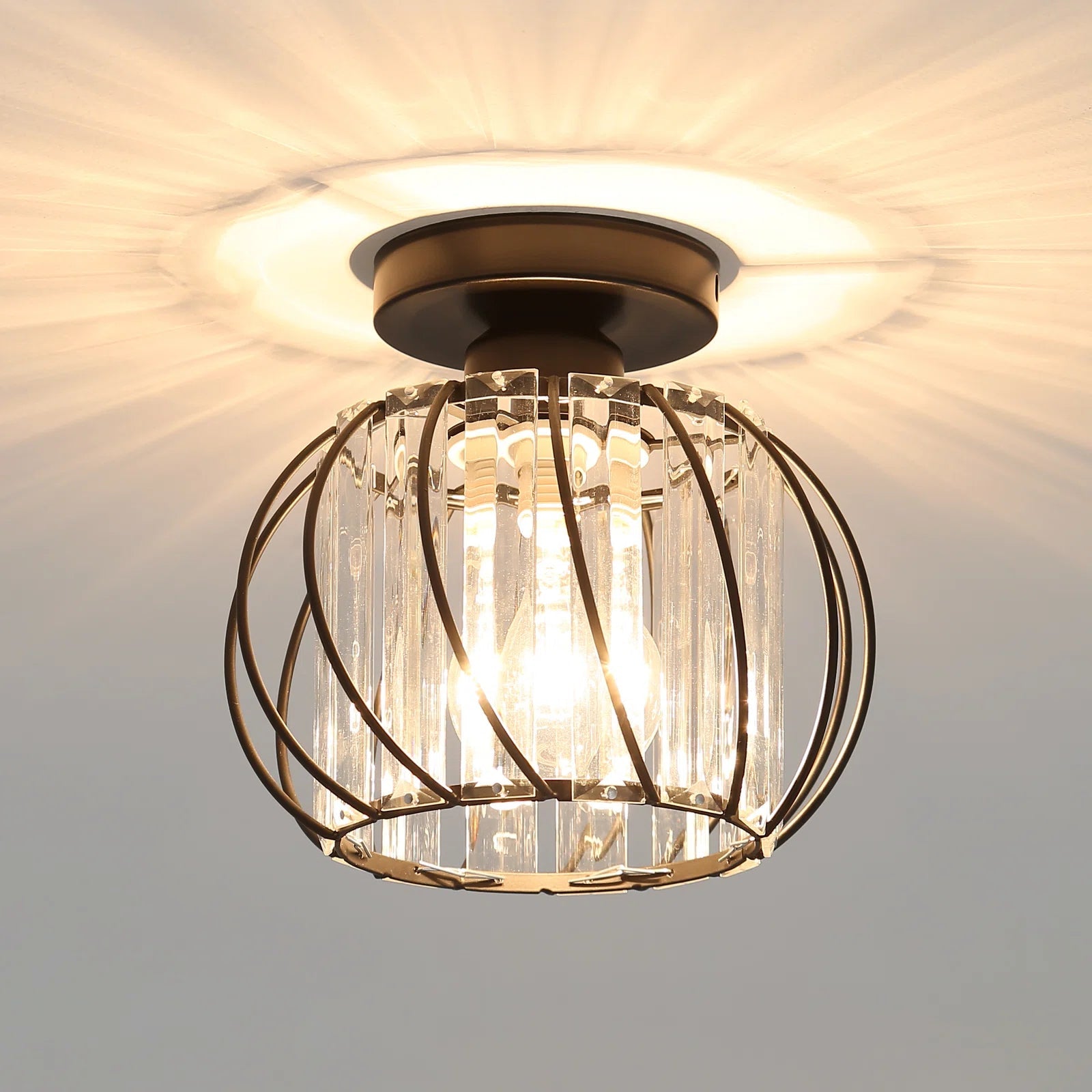 Modern black crystal cage flush mount yilo ceiling light casting a dramatic starburst pattern