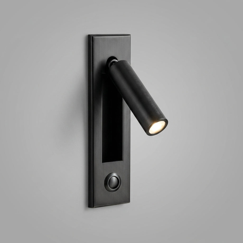 Zexto wall sconce in black finish showing the button switch, on a grey studio background