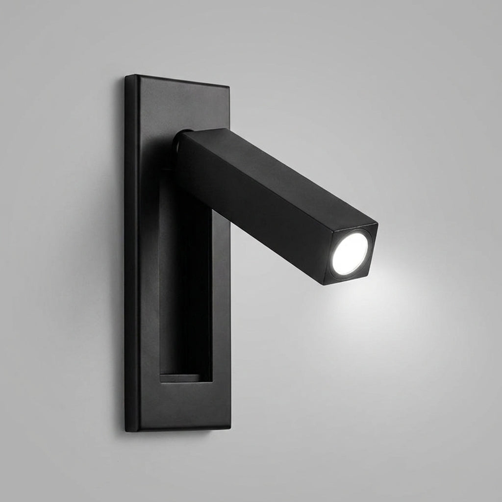 Zexto wall sconce in black finish, illuminated, on a grey studio background