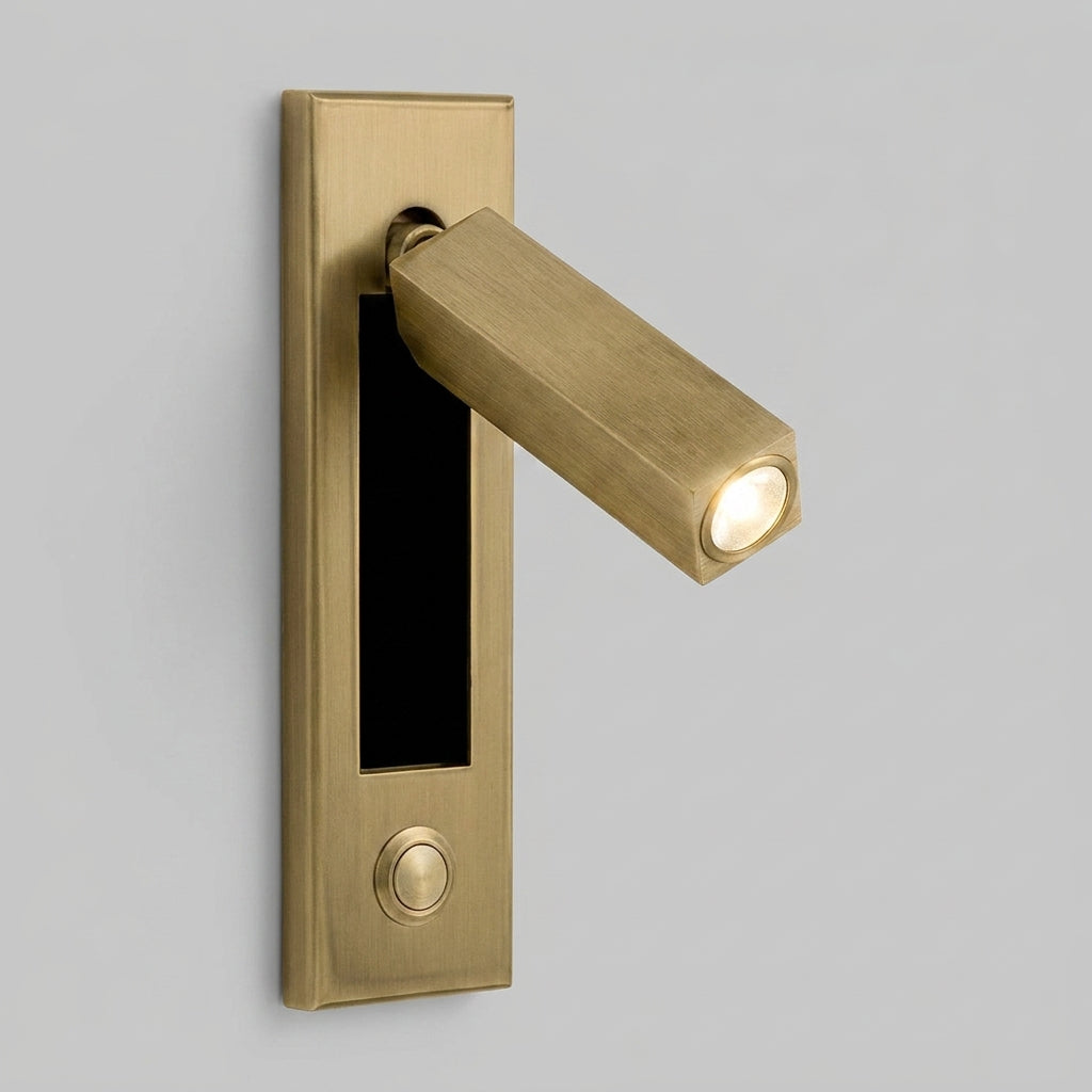 Zexto square wall sconce in gold finish showing the button switch on a grey studio background