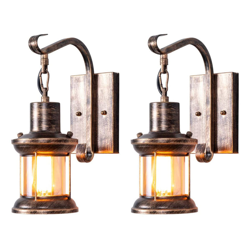 Pair of rustic zupce bronze hanging lantern wall sconces isolated on a white background