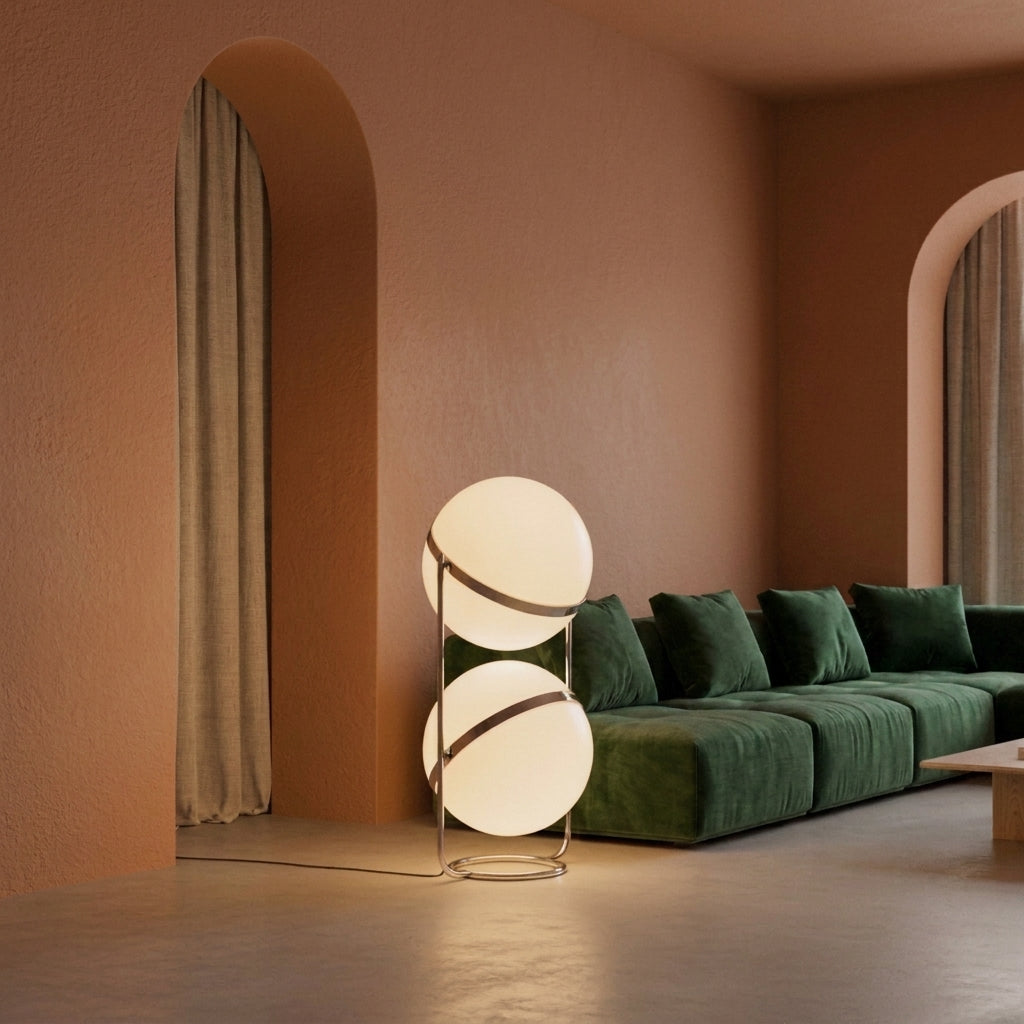Zylpa Duo stacked chrome sphere floor lamp in a terracotta arched living room beside a green sofa